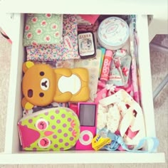 a drawer filled with lots of toys and other items