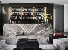 an elegant living room with marble furniture