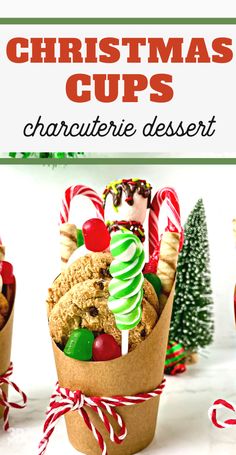 christmas cups with candy and cookies in them