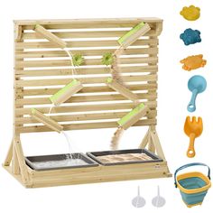 a wooden play set with utensils and other items to make it look like an outdoor kitchen