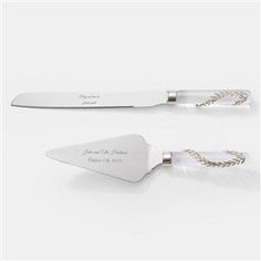 two knives with engraved names on them sitting next to each other in front of a white background