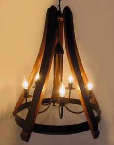 a wooden chandelier with lights hanging from it