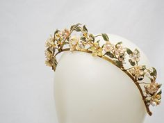 "This romantic and whimsical garden style headpiece is created for the modern bride, looks beautiful worn at weddings, Events, anniversaries and many other special occasions. Features: - Handmade wired Leaves and flowers adorned with assorted beads - Coloured in pastels , Blue, yellow, pink, green, cream, white and gold - Gilded resin sealed base for a durable and golden metallic effect Approximate Measurements  1.5\" tallest point when worn 14\" band length ------------------------------------------------ *Disclaimer: Due to the handmade nature of this product each headpiece is truly unique and special in its own way and may have slight variations Please keep in mind before purchasing this product is \"MADE TO ORDER\" and has a production time of 1-2 weeks + shipping time to your area Shi Tiara Floral, Bride Looks, Bridal Floral Headpiece, Bridal Headpiece, Bridal Crown, Bridal Tiara, Floral Bridal, Tiaras And Crowns, Bridal Headpieces