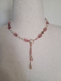 "This necklace is 18\" long, plus a 3\" drop on the double teardrop lariat closure. There are Swarovski glass pearls, Murano glass beads, and tiny glass beads in pink, ecru, and clear. These are strung on wire, and 14k gold filled components are used. Presented in an organza drawstring bag." Homemade Jewelry Ideas Necklace, Bead Jewellery Making Ideas Necklaces, Diy Gold Necklace, Long Beads Necklace, Necklace Gemstone, Pink Elegant Dangle Beaded Necklaces, Pink Czech Glass Necklaces With Faceted Beads, Adjustable Pink Pearl Necklace With Beaded Chain, Pink Pearl Drop Beaded Necklaces With Round Beads