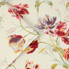 the wallpaper has flowers on it and is white with red, yellow and purple