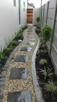 a walkway made out of stones and gravel