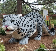 a lego model of a cheetah in the woods