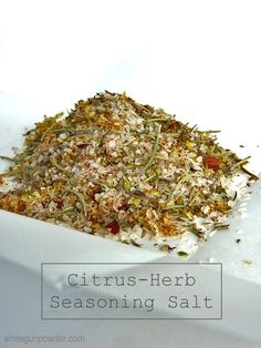 a pile of herbs sitting in a white bowl