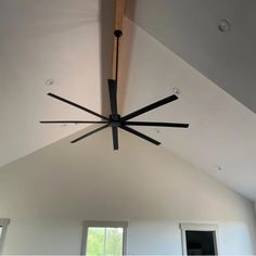 a ceiling fan in the middle of a room