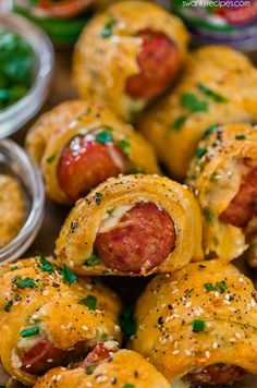 sausage wrapped in cheese and surrounded by other appetizers