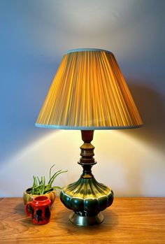 Wonderful vibrant drip glaze pottery lamp with wooden & brass accents. circa 1960-1970s. Hues of green yellow & white. Overall good pre-loved condition with a complimenting pleated vinyl/ plastic fabric lamp shade in a "Golden Harvest" Yellow. **Purchaser receives both the lamp base & lampshade shown. Some minor patina that comes with age, just as shown in photos & video but nothing severe. This has a tri-light turn switch & will take a tri-light bulb for 3 light settings. Wiring appears in good Academia Living Room, Fabric Lamp Shade, Lamp Ceramic, Glaze Pottery, Fabric Lamp, Golden Harvest, Plastic Fabric, Pottery Lamp, Hues Of Green