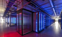 rows of servers in a data center with red and blue lights