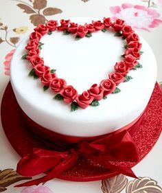 a heart shaped cake on top of a table