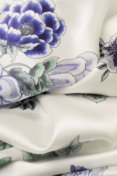 This sophisticated floral print on a silk satin is a testament to timeless elegance. 100% Made in Como Italy. Generous size: Approx. 27" x 78". You can wear this wrap as an elegant evening shawl and also as a daytime scarf. A timeless addition to your wardrobe. 100% silk satin: A silky, soft, lustrous fabric that feels oh-so sumptuous. Rolled hems: The hems are hand rolled as they are sewn with a sewing machine. It takes skill and experience to make a neat hem. Pure luxury, naturally dyed: We us Elegant Printed Silk Scarf, Elegant Spring Silk Scarf With Satin Finish, White Silk Scarf With Floral Print, Elegant Silk Scarf With Floral Print For Formal Occasions, Luxury Floral Print Silk Scarf For Spring, Spring Satin Silk Scarf With Satin Finish, Spring Silk Scarf With Satin Finish, Elegant Floral Print Silk Scarf, Elegant Floral Silk Scarf