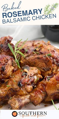 a close up of chicken on a plate with rosemary garnish and balsamic