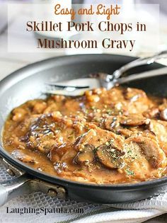 a skillet filled with meat and mushroom covered in gravy on a table