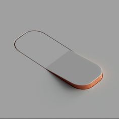 an orange and white rectangular object on a gray surface