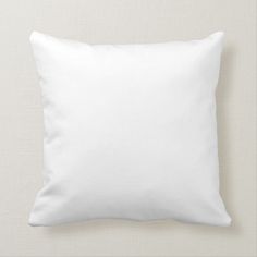 a plain white pillow on a beige background