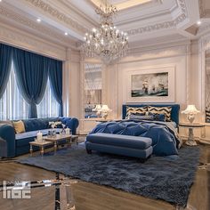 a luxurious bedroom with blue furniture and chandelier hanging from the ceiling, along with large windows