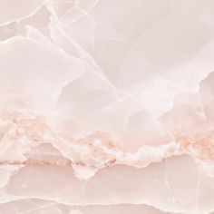 an abstract marble background with pink and gold highlights on the top right hand corner,