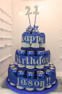 a birthday cake made to look like it is stacked with cans