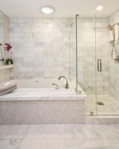 a bathroom with a large tub and walk in shower