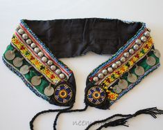 Green childrens hippie boho tribal belt with real coins, beaded borders and kuchi buttons. Length: 68 cm / 26.776 " At the front there are two lovely blue beadwork medallions and cords to tie. Inside there is a lining of new black cotton material. These kind of belts are meant to be worn over the hips at the back from hip bone to hip bone. Origin: Handmade in Afghanistan / Pakistan The belt is vintage, but in a very good condition. Hip Bone, Boho Belt, Yarn Craft, Boho Belts, Dresses Indian, Suspender Belt, Yarn Crafts, Larp, Boho Hippie