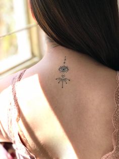 a woman with a tattoo on her back