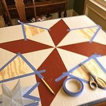 scissors and tape are sitting on top of a table that is decorated with red, white and blue stars