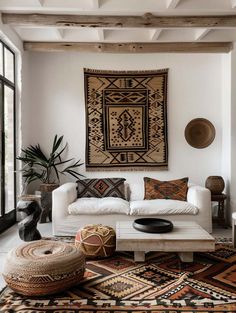 a living room filled with furniture and rugs