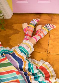 Make your look extra colorful with our oh-so-sweet Candy Stripe Ruffle Sock. We elevated the design with peekaboo sheer stripes and a sheer ruffle cuff. Shop on SockCandy.com. Fashion socks, socks and sandals, socks and heels, socks and shoes, rainbow outfit, rainbow shoes. Maximalist Photoshoot, Ruffle Sock, Sandals Socks, Women Socks Fashion, Rainbow Style, Ruffled Socks, Rainbow Shoes, Purple Heels, Sheer Socks