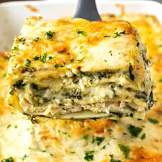 a close up of a casserole being held by a fork