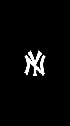 the new york yankees logo is shown in black and white on a dark background,