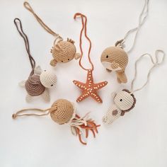 crocheted sea animals and starfish are arranged in the shape of an ornament