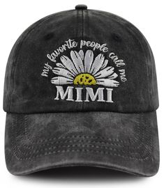 a black hat with white daisies and the words, i'm favorite people are mimi