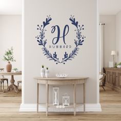 a wall decal with the letter o in a wreath on it's side