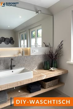 a bathroom sink sitting under a mirror next to a window