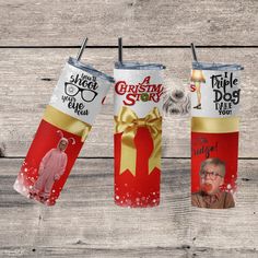 three christmas themed tumblers with pictures on them