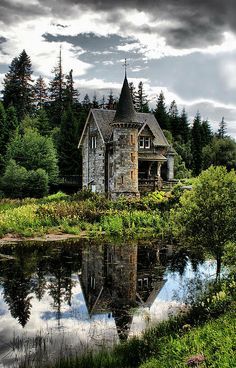 an image of a house in the woods