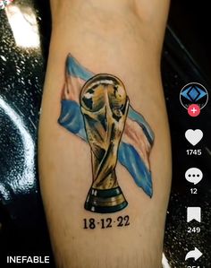 a tattoo with an image of the world cup on it