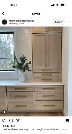 a kitchen with wooden cabinets and white counter tops on instagramting from an instagramtor