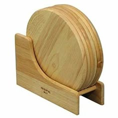 a wooden plate holder with three slices of wood on it's sides and one piece of wood in the middle