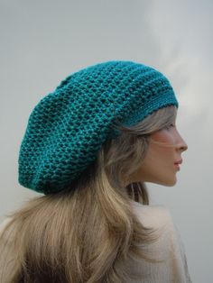 This posting is for the awesome slouchy tam colors you see pictured. The hat for this posting was made with a band of 18 inches around with some stretch room if needed. The bag itself is 28 inches wide at its widest point. The hat is 12 inches from band to tip of the hat.  This hat is an interesting teal. We take our photos outside in natural lighting. If the sky is overcast the color is a blue teal. If the sky is sunny, it brings out the more dark green teal shade. It is a very nice change betw Handmade Slouchy Cap, Handmade Slouchy Cap Hat, Casual Handmade Beret, One Size, Handmade Casual Beret One Size, Casual Handmade Beret, One Size Fits Most, Handmade Casual One-size Beret, Rasta Hat, Hippie Hat, Green Cap