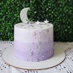 a purple cake with stars and a crescent on top