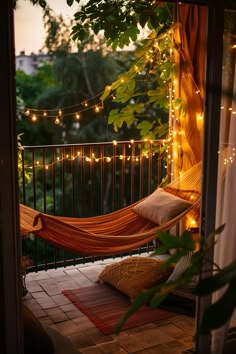 A cozy small balcony decor with a hammock, twinkling lights, and lush greenery, creating a perfect outdoor living space. Unique Balcony Ideas, Balcony Bed, Balcony Hammock Ideas, Hygge Balcony, Balcony Screen, Tiny Balcony Aesthetic, Small Balcony Makeover, Hammock Balcony Apartment