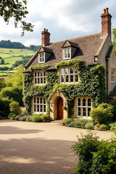 Ivy-covered country house with sloping roof and tall chimneys. Explore the quirky charm, secret staircases, and unintentional labyrinths of British country houses, where historical oddities meet modern mishaps in the most delightful way.