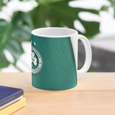 a starbucks coffee mug sitting on top of a wooden table