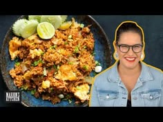 a woman standing next to a plate of food