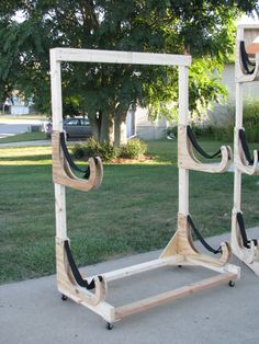 two wooden frames sitting on top of a sidewalk