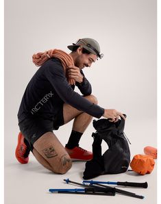 a man sitting on the ground with his legs crossed